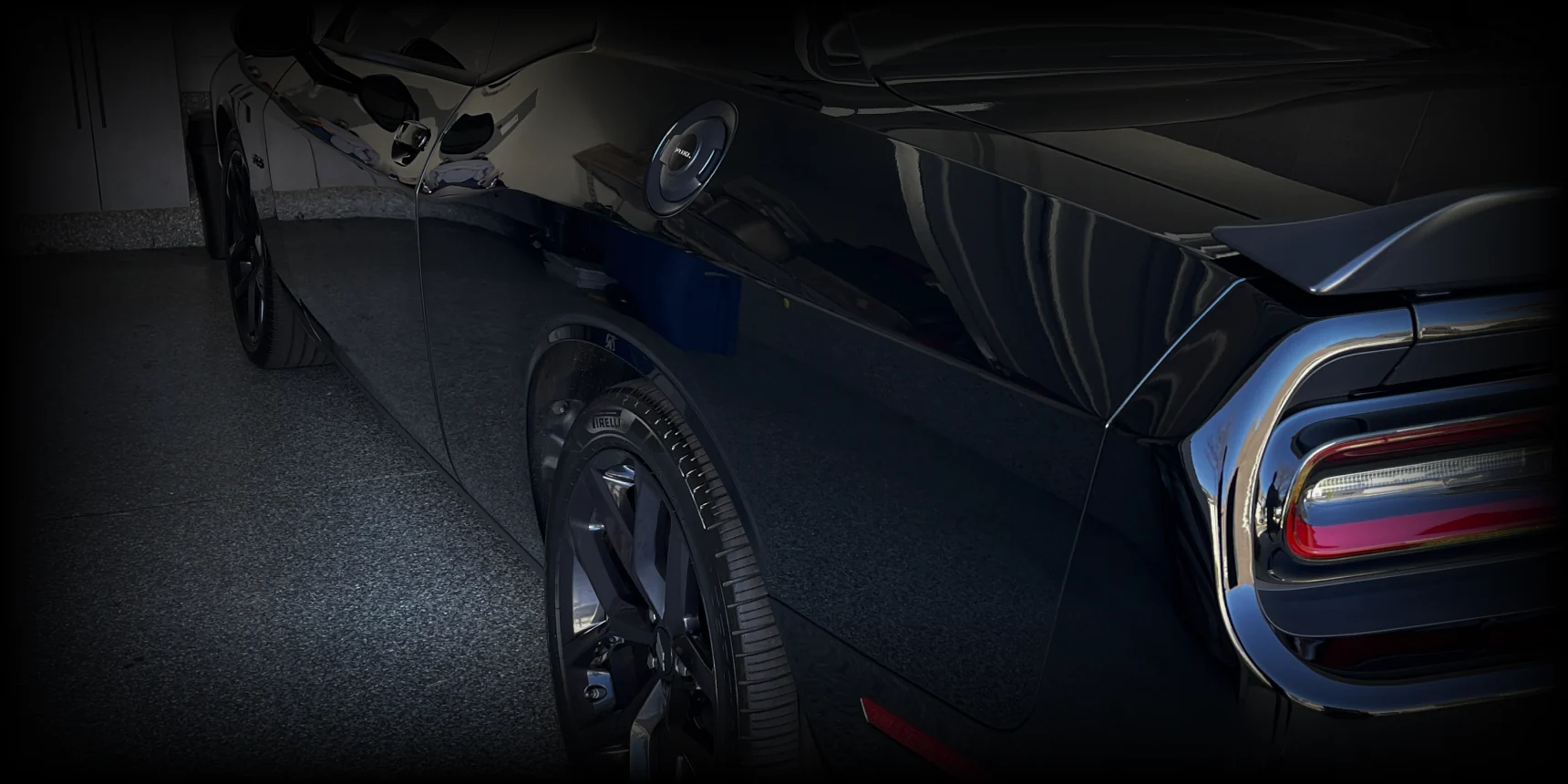 Close-up of a professionally detailed dark blue vehicle
