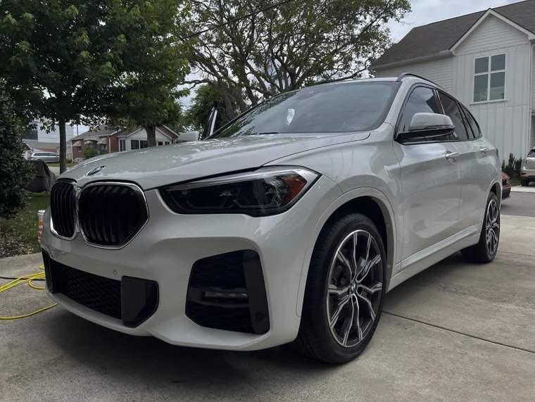 White BMW SUV after a mobile detail on a Franklin driveway